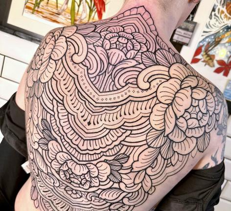 Ornamental floral back piece in fine black linework