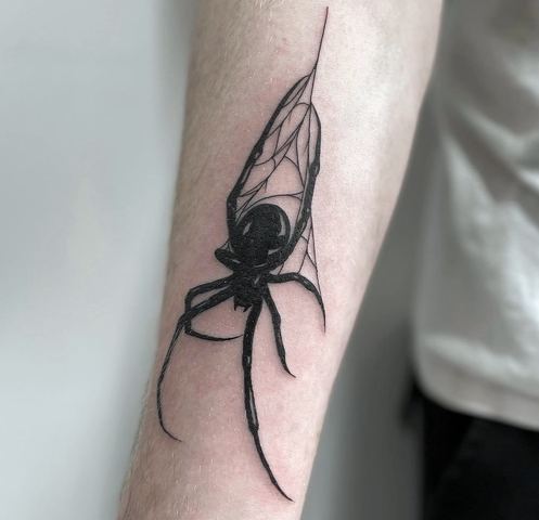 Blackwork spider on its web