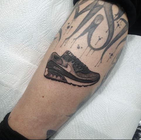 Blackwork trainer with script lettering