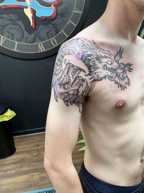 Dragon across the shoulder and chest