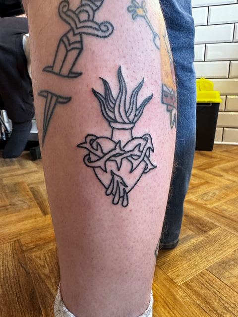 Traditional sacred heart in black linework